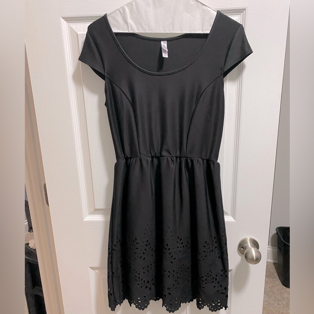 Black a-line, cap sleeve dress with adorable cut out hem